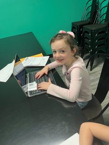 Home girl.using .laptop.at .kidtopia.playland.huntsville.afterschool.care 1280x1707